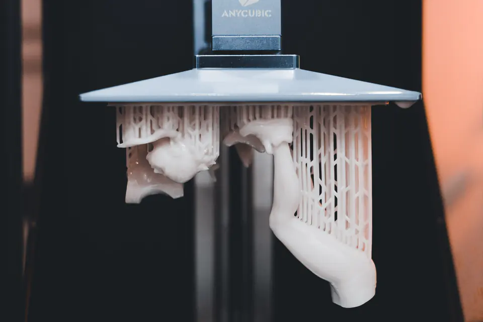 Close-up of a resin 3D printer building a part